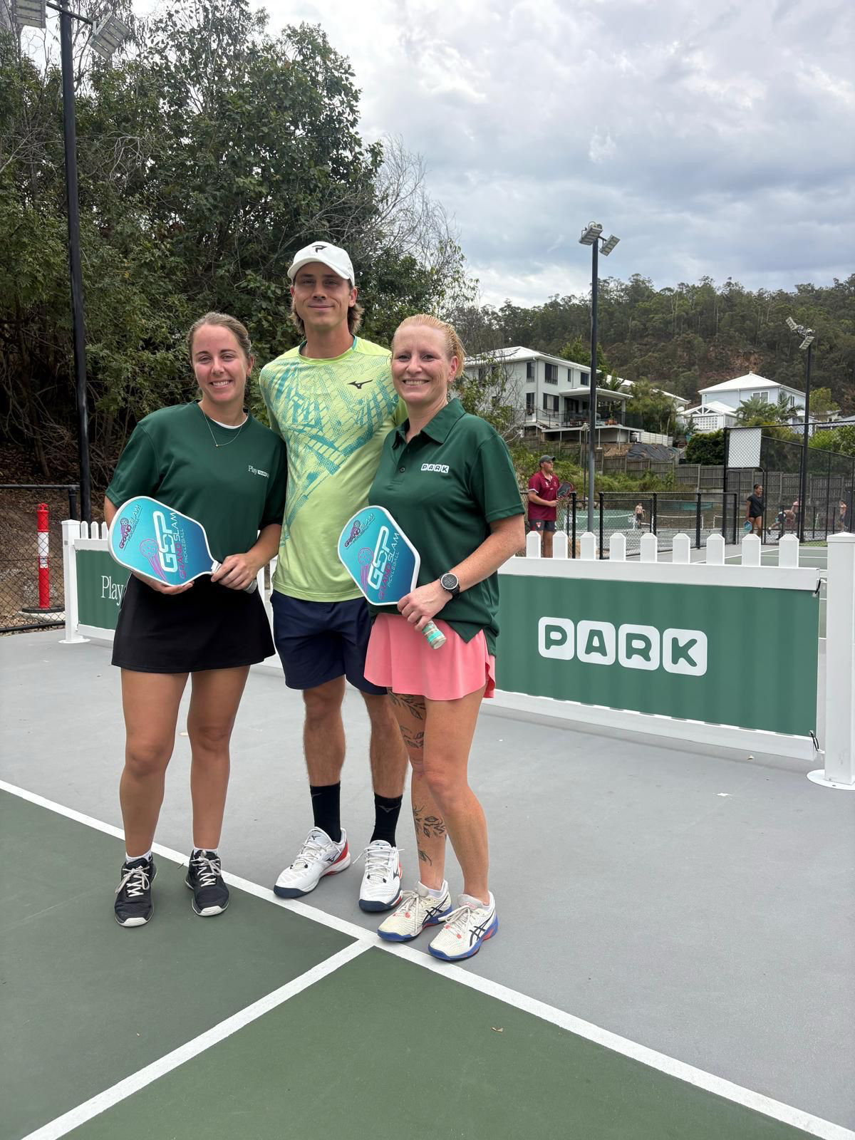 Christian Alshon with PARK coaches on a pickleball court at PARK The Gap